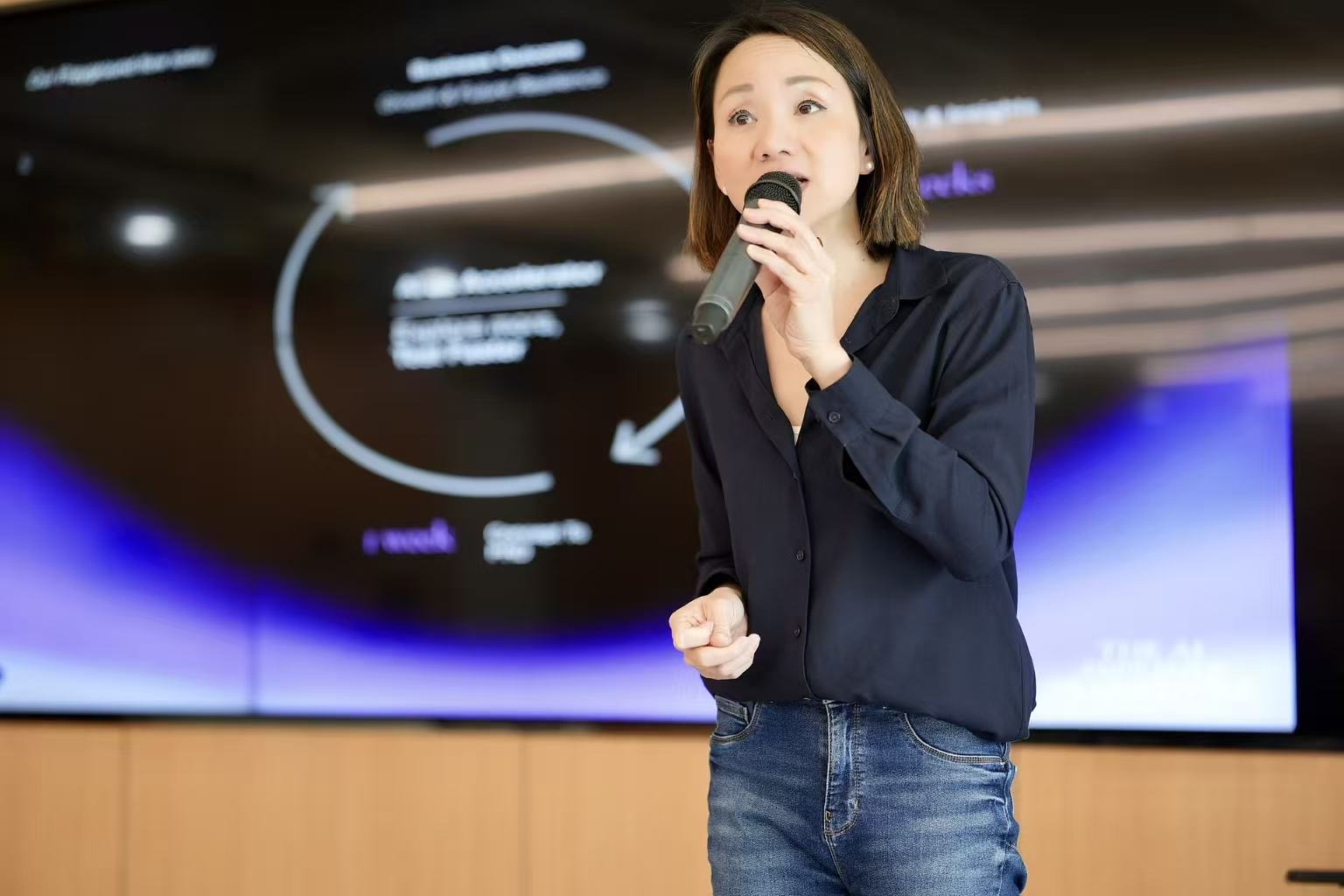 Jenny Kan speaking on stage