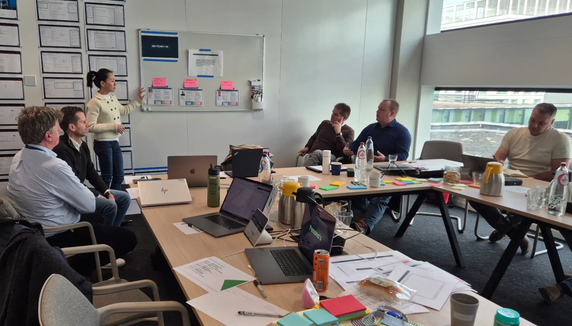 Jenny Kan presenting the CQN future state on a whiteboard during a co-creation workshop at ASML