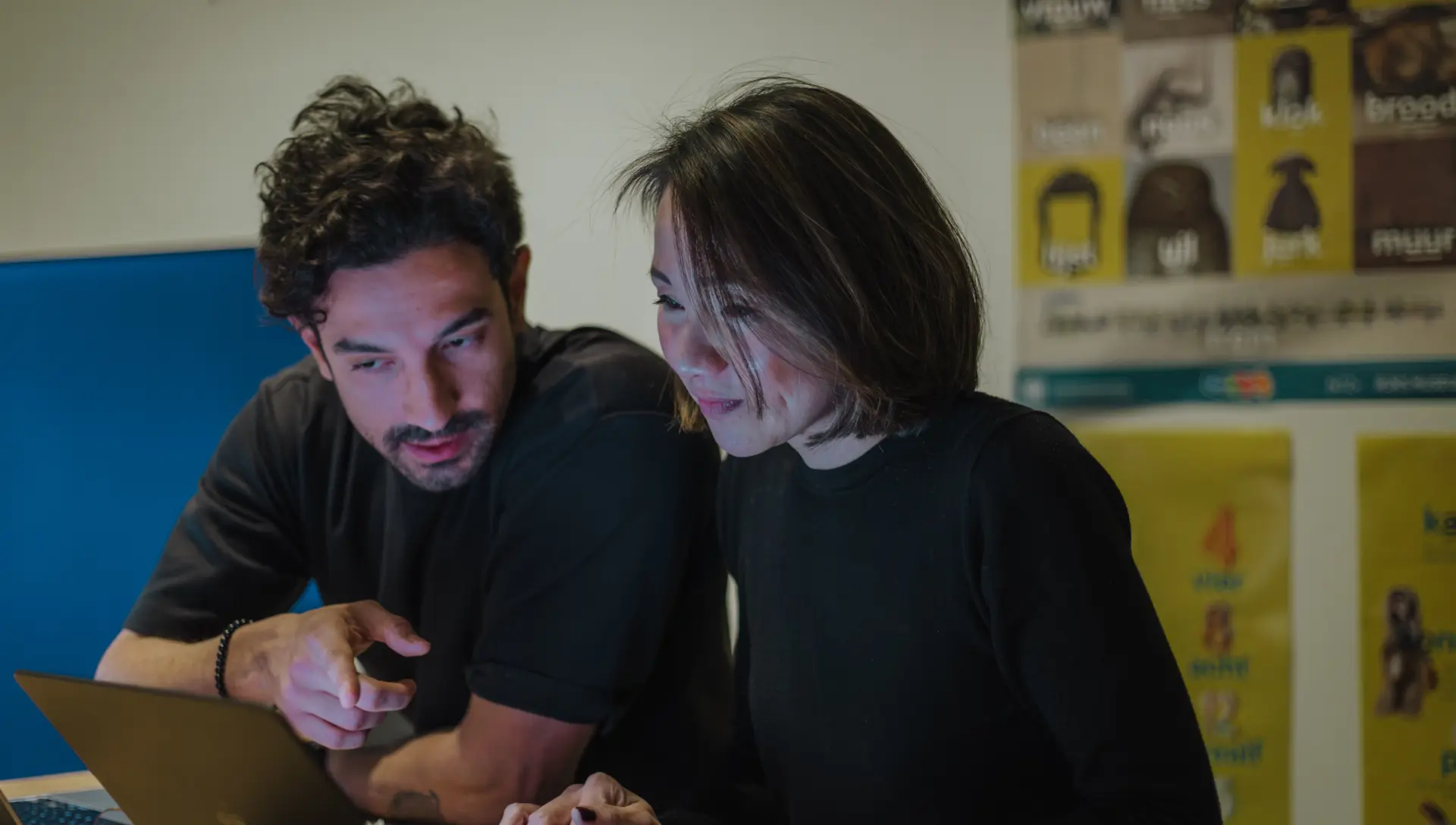 Two team members co-creating the framework together at a laptop